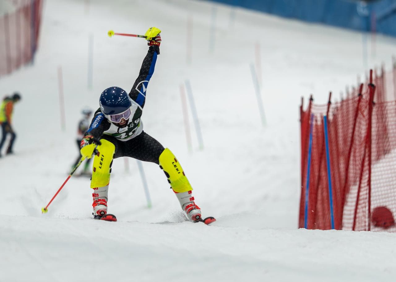 Skier descending a snowy slope in Gulmarg